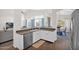 Bright kitchen features white cabinets, stainless steel appliances, and views to the backyard at 4611 E Night Glow Dr, Cave Creek, AZ 85331
