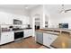 Well-equipped kitchen with white cabinets, stainless steel appliances, and ample counter space at 4611 E Night Glow Dr, Cave Creek, AZ 85331