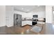 The kitchen features updated appliances, white cabinets, and a functional layout for cooking at 4611 E Night Glow Dr, Cave Creek, AZ 85331