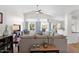 Bright living room featuring vaulted ceilings, large windows, and comfortable seating arrangements at 4611 E Night Glow Dr, Cave Creek, AZ 85331