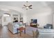 Inviting living room with a ceiling fan, tile floors, and open floor plan at 4611 E Night Glow Dr, Cave Creek, AZ 85331