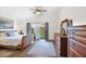 Serene main bedroom featuring wooden floors and sliding doors to the backyard at 4611 E Night Glow Dr, Cave Creek, AZ 85331