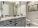 Bathroom features granite countertops, gray cabinetry, and neutral paint at 5328 S Wesley Cir, Mesa, AZ 85212