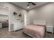 A bedroom featuring a comfortable bed, modern dresser, and a walk-in closet with ample storage at 5328 S Wesley Cir, Mesa, AZ 85212