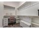 Walk-in closet featuring custom shelving, drawers, and ample space for storage and organization at 5328 S Wesley Cir, Mesa, AZ 85212