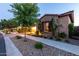 Charming home with stone accents, inviting curb appeal, and verdant landscaping at 5328 S Wesley Cir, Mesa, AZ 85212