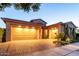 Beautiful home with a spacious three-car garage and a well-maintained brick driveway at 5328 S Wesley Cir, Mesa, AZ 85212