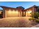 Beautiful home with a spacious three-car garage and a well-maintained brick driveway at 5328 S Wesley Cir, Mesa, AZ 85212