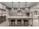 Modern kitchen with grey cabinets, granite countertops, stainless steel appliances, and a spacious island at 5328 S Wesley Cir, Mesa, AZ 85212