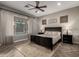 Comfortable main bedroom with decorative wallpaper and a ceiling fan at 5328 S Wesley Cir, Mesa, AZ 85212