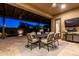 Covered patio with dining table, chairs and lighting for outdoor enjoyment at 5328 S Wesley Cir, Mesa, AZ 85212