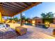 Well lit swimming pool and patio area with cozy outdoor seating at 5328 S Wesley Cir, Mesa, AZ 85212