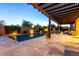 Inviting outdoor space featuring a pool and covered patio with outdoor furniture at 5328 S Wesley Cir, Mesa, AZ 85212
