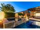 Outdoor spa and seating area with lush landscaping and serene ambiance at 5328 S Wesley Cir, Mesa, AZ 85212
