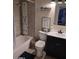 Bathroom with a shower, toilet, modern vanity, and a decorative mirror at 5539 N 31St Ln, Phoenix, AZ 85017