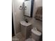 A well-maintained bathroom with a modern vanity, stylish fixtures, and tiled flooring at 5539 N 31St Ln, Phoenix, AZ 85017