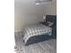 This bedroom features a comfortable bed, ceiling fan, and hardwood-style flooring at 5539 N 31St Ln, Phoenix, AZ 85017