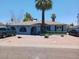 Charming single-story home with mature palm tree and desert landscaping in the front yard at 5539 N 31St Ln, Phoenix, AZ 85017