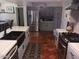 Stylish kitchen features stainless steel appliances and unique terracotta tile flooring at 5539 N 31St Ln, Phoenix, AZ 85017