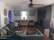 Comfortable living room featuring stylish sofas, decorative artwork, and a brick fireplace at 5539 N 31St Ln, Phoenix, AZ 85017