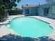 Backyard with a pool, basketball hoop, and a glimpse of the gazebo for relaxation at 5539 N 31St Ln, Phoenix, AZ 85017