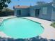 Refreshing pool with cool water, surrounded by a concrete patio and the house at 5539 N 31St Ln, Phoenix, AZ 85017