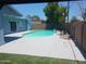 Inviting pool area with a view of the house, mature tree, and palm tree at 5539 N 31St Ln, Phoenix, AZ 85017