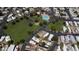 Aerial view shows community amenities, including swimming pool, basketball court and park at 5601 W Missouri Ave # 150, Glendale, AZ 85301