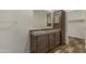 Bathroom vanity with cabinets and drawers; includes a large framed mirror at 5601 W Missouri Ave # 150, Glendale, AZ 85301