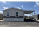A single story home features neutral colored siding, carport and landscaping under a blue sky at 5601 W Missouri Ave # 150, Glendale, AZ 85301