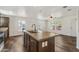 Bright, open floorplan combining living room and kitchen with large island at 5601 W Missouri Ave # 150, Glendale, AZ 85301
