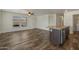 The light-filled open floorplan combines living room, kitchen, and vinyl plank flooring at 5601 W Missouri Ave # 150, Glendale, AZ 85301