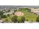 Aerial view of baseball field with green grass and clear skies, great for community sports at 5749 S 21St Ter, Phoenix, AZ 85040