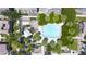 Aerial view of community pool surrounded by lush greenery and palm trees, creating a relaxing oasis at 5749 S 21St Ter, Phoenix, AZ 85040