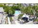 Aerial view of the beautiful community pool area with palm trees, seating, and picnic tables at 5749 S 21St Ter, Phoenix, AZ 85040