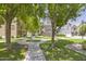 Landscaped community featuring sidewalks, lush grass and shade trees at 5749 S 21St Ter, Phoenix, AZ 85040
