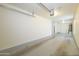 Large garage with concrete floor and lighting ready for storage or parking at 5749 S 21St Ter, Phoenix, AZ 85040