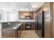 Beautiful kitchen features granite countertops, stainless steel appliances, and ample cabinet space at 5749 S 21St Ter, Phoenix, AZ 85040