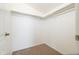 Bright walk-in closet with neutral carpet and plentiful clothes-hanging bars and storage space at 5749 S 21St Ter, Phoenix, AZ 85040