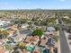 This aerial view showcases the neighborhood with homes, mature trees, and a quiet location at 608 E Arabian Ct, Gilbert, AZ 85296