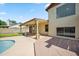 This home features a covered back patio area and pool, perfect for entertaining or relaxing at 608 E Arabian Ct, Gilbert, AZ 85296