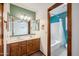 Bathroom featuring double sinks, updated fixtures, and access to a separate area with a bathtub and shower at 608 E Arabian Ct, Gilbert, AZ 85296
