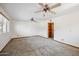 Bedroom with neutral carpet and windows for lots of natural light and wooden built in shelves at 608 E Arabian Ct, Gilbert, AZ 85296