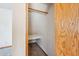 Small closet with wooden trim and shelf for storage of clothes and other items at 608 E Arabian Ct, Gilbert, AZ 85296