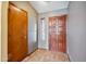 Foyer with tile floor, wood doors, and neutral walls providing a warm welcome at 608 E Arabian Ct, Gilbert, AZ 85296