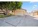 Inviting home featuring an attached two-car garage and a spacious driveway at 608 E Arabian Ct, Gilbert, AZ 85296