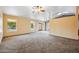 Bright and spacious living room with plush carpeting and ample natural light at 608 E Arabian Ct, Gilbert, AZ 85296