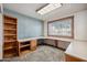 Office with built in desk with lots of natural light from the window and shelving for storage at 608 E Arabian Ct, Gilbert, AZ 85296