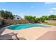 Backyard pool surrounded by concrete, block wall, and trees for privacy at 608 E Arabian Ct, Gilbert, AZ 85296