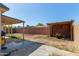 A partially shaded backyard with some grass at 8051 W Mariposa Dr, Phoenix, AZ 85033
